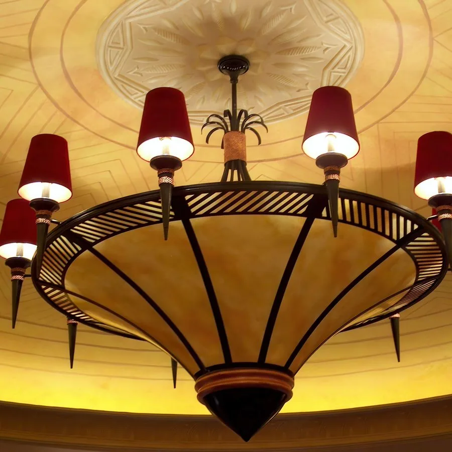 Art deco chandelier with red shades in a casino salon prive