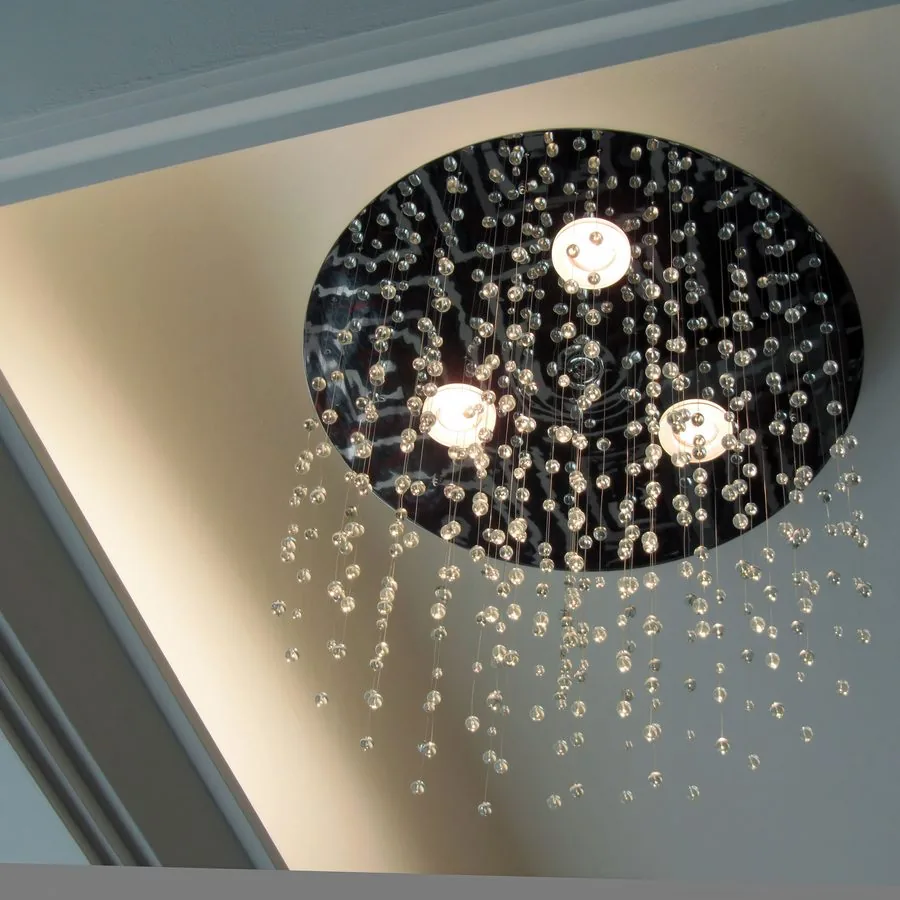 Circular ceiling fitting with cascading crystal drops