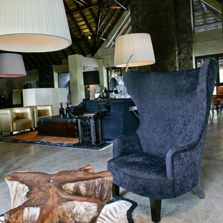 Oversized drum pendants in a game lodge lounge