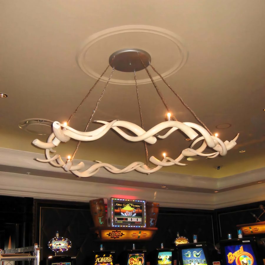 Sculptural white ring chandelier on a gaming floor