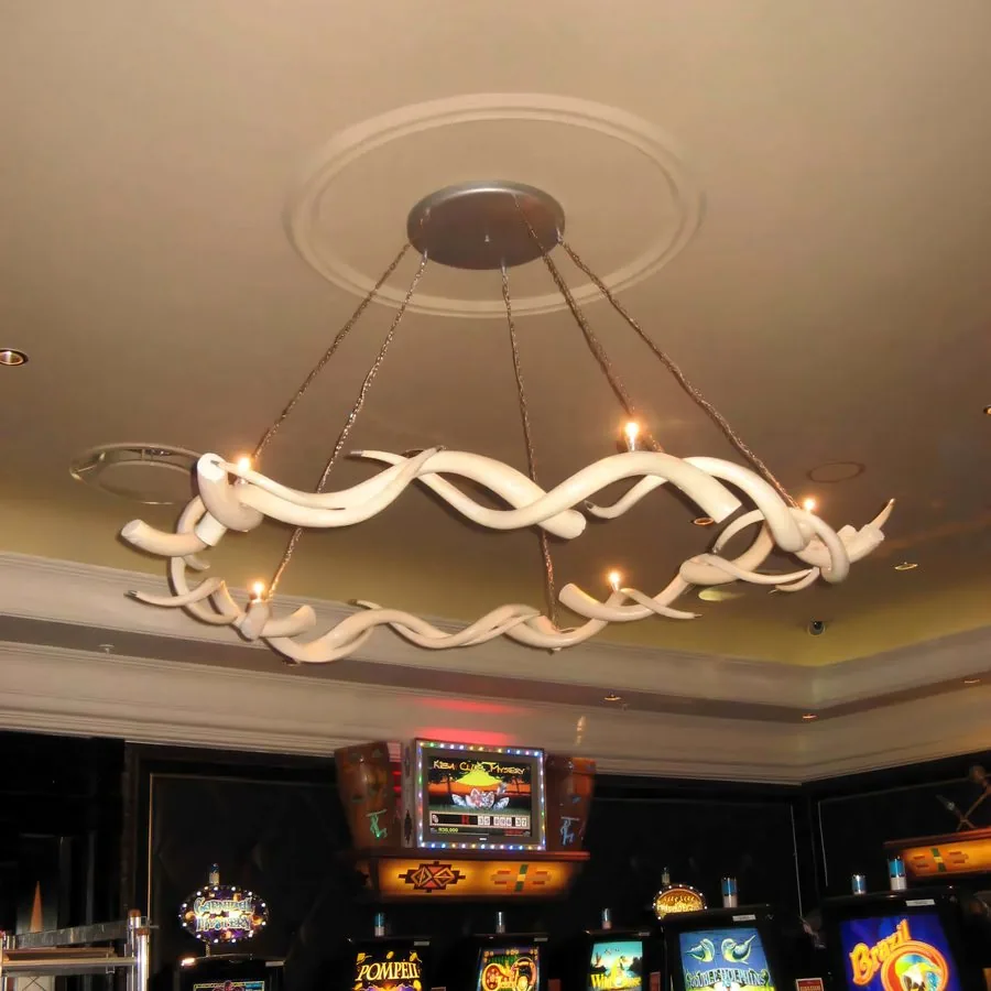 Sculptural white ring chandelier on a gaming floor